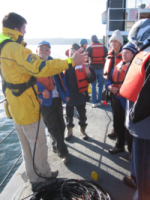 Jonathan Kellogg, OIP volunteer and UW graduate student, conducts research on Puget Sound with marine volunteers