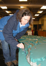 A workshop participant working with a model of currents in Puget Sound