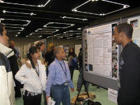 High school apprentices presenting their research poster at the 2010 Ocean Science Meeting