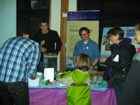 Seattle Aquarium guests participating in the School of Oceanography's popular display The Great Plankton Race