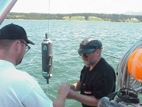 Dr. Russell Cuhel demonstrates sampling equipment aboard the R/V Neeskay