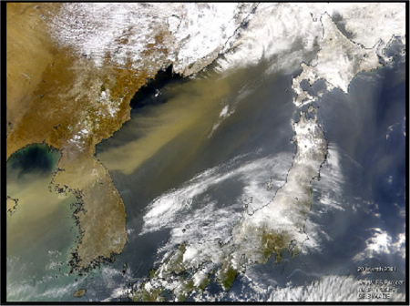 A satellite image tracks a dust cloud moving east over the Korean Peninsula into the Sea of Japan (the white patches are clouds).